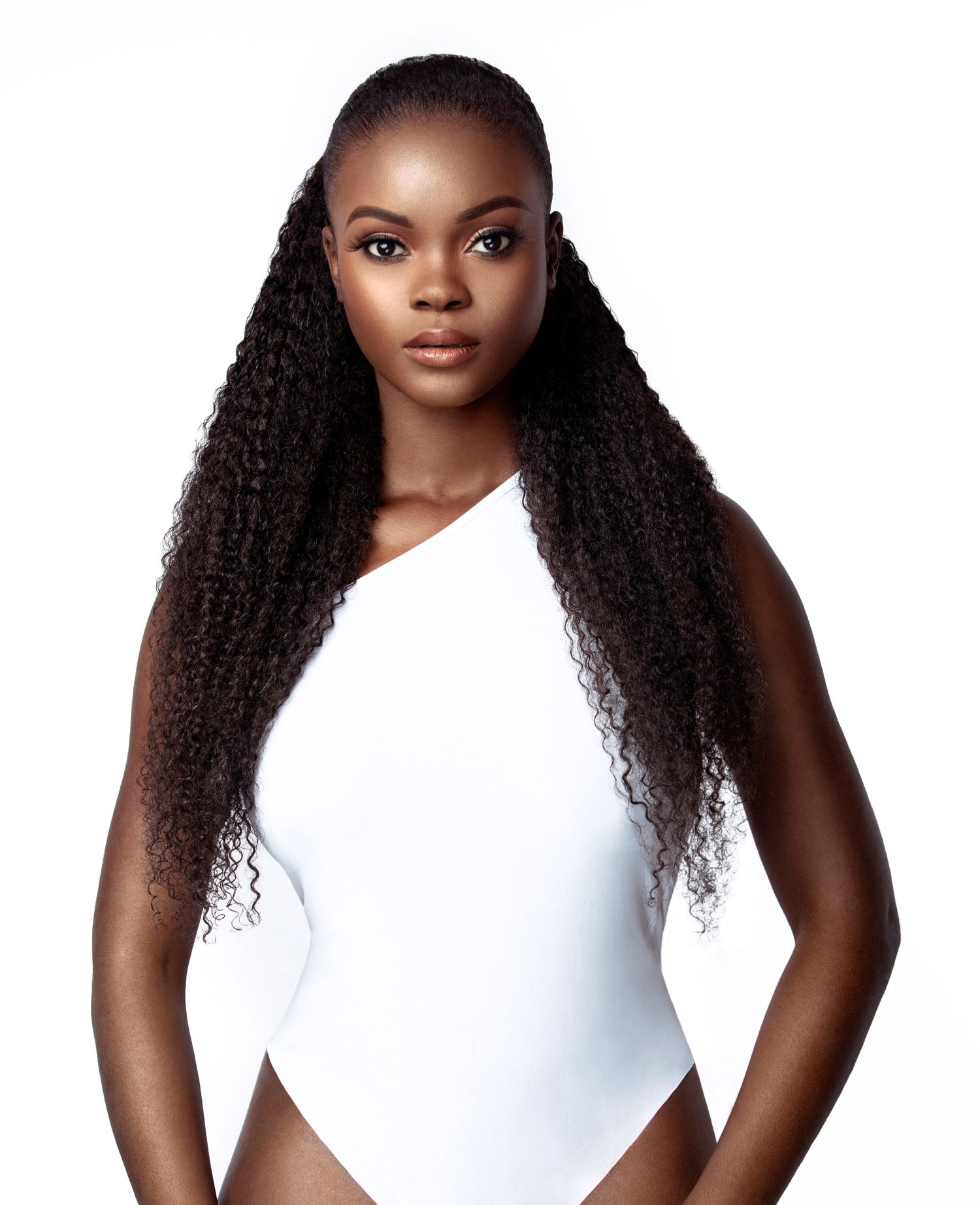 A model with long, curly hair. The model&