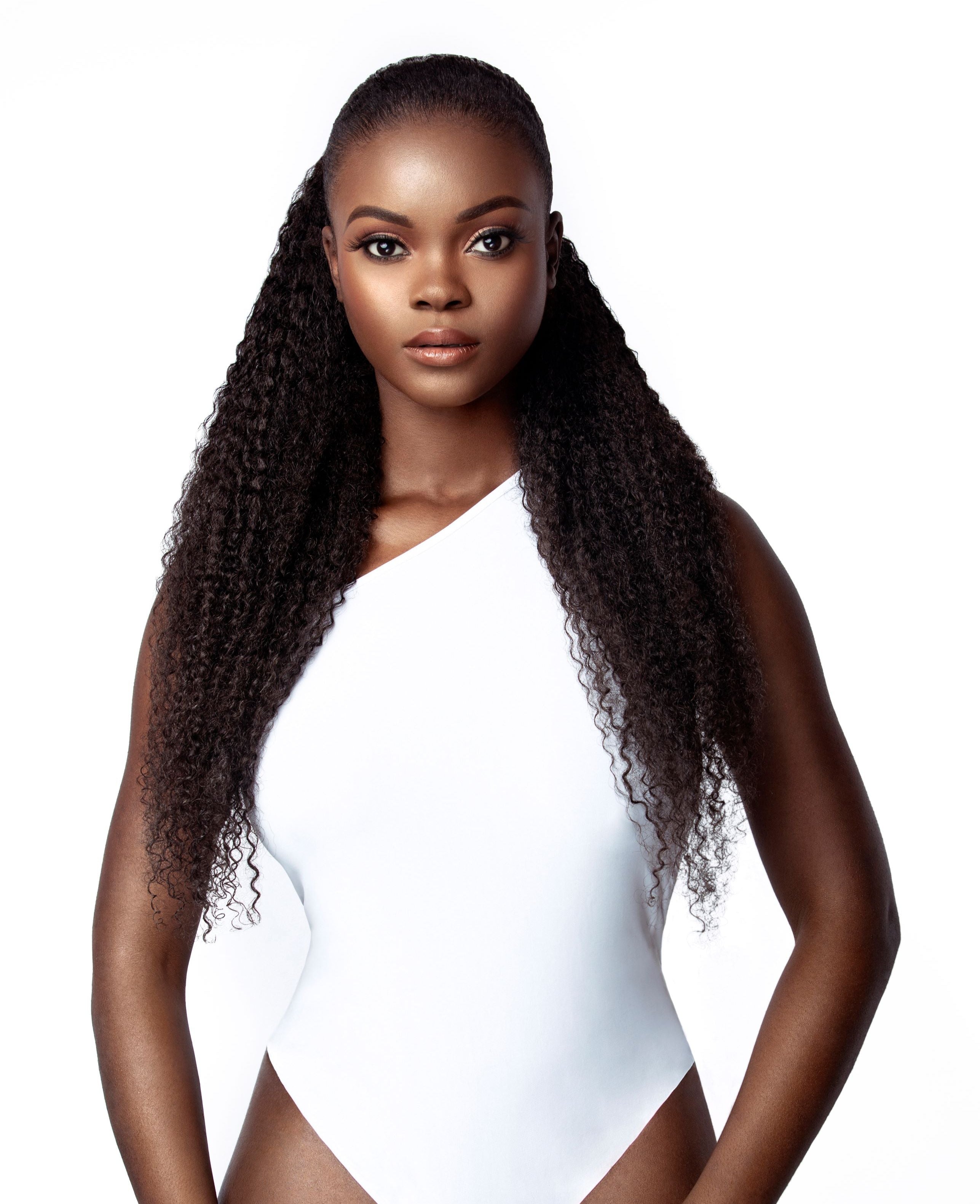 A model with long, curly hair. The model&