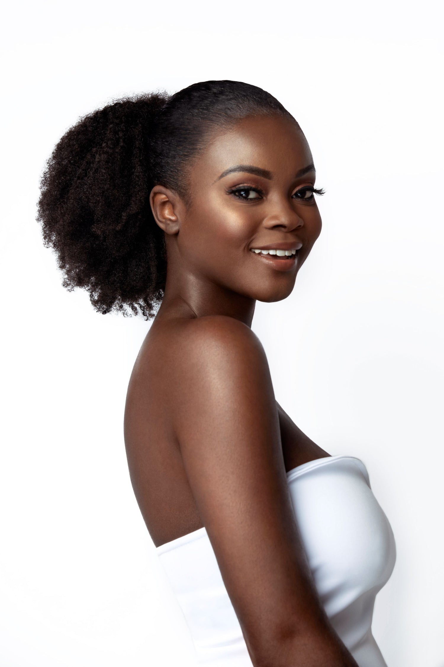 a girl wearing a sleek ponytail on natural hair