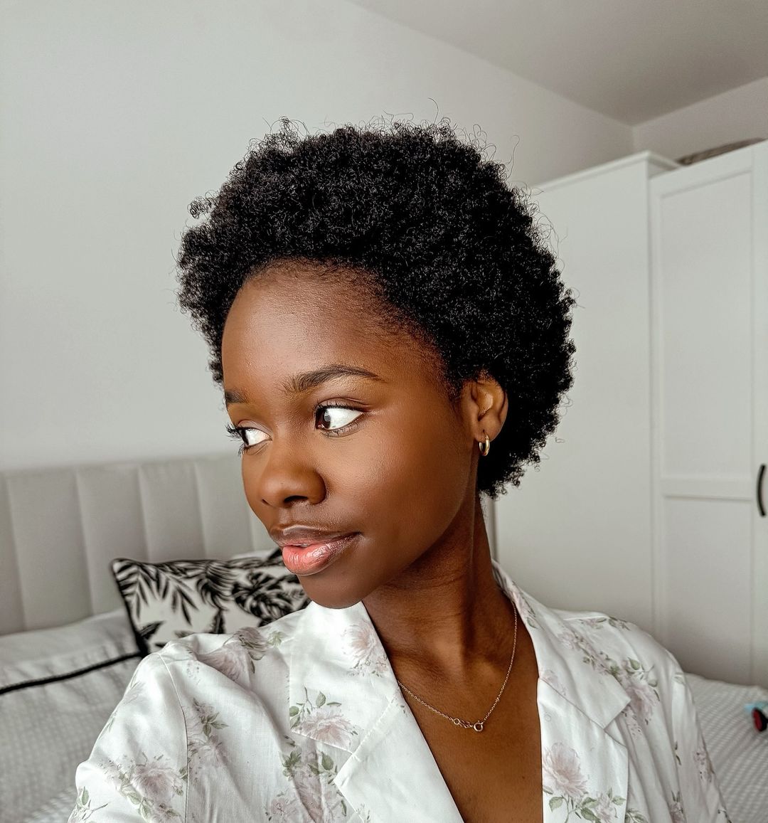 a black woman with short natural afro hair