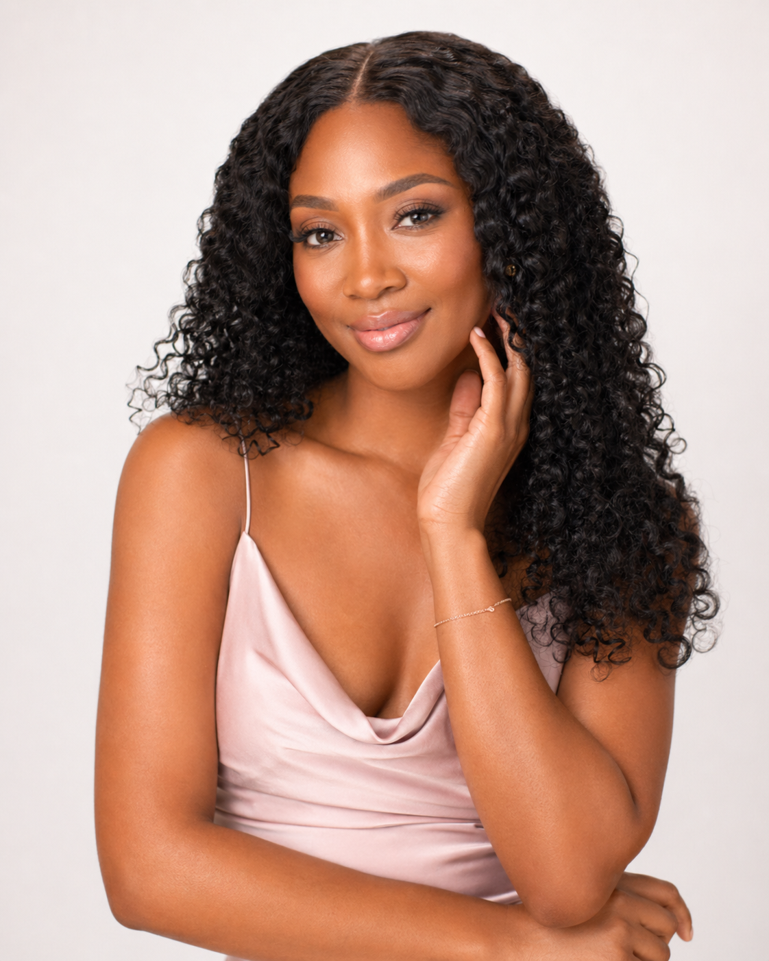 a black woman wearing a brazilian curly wig