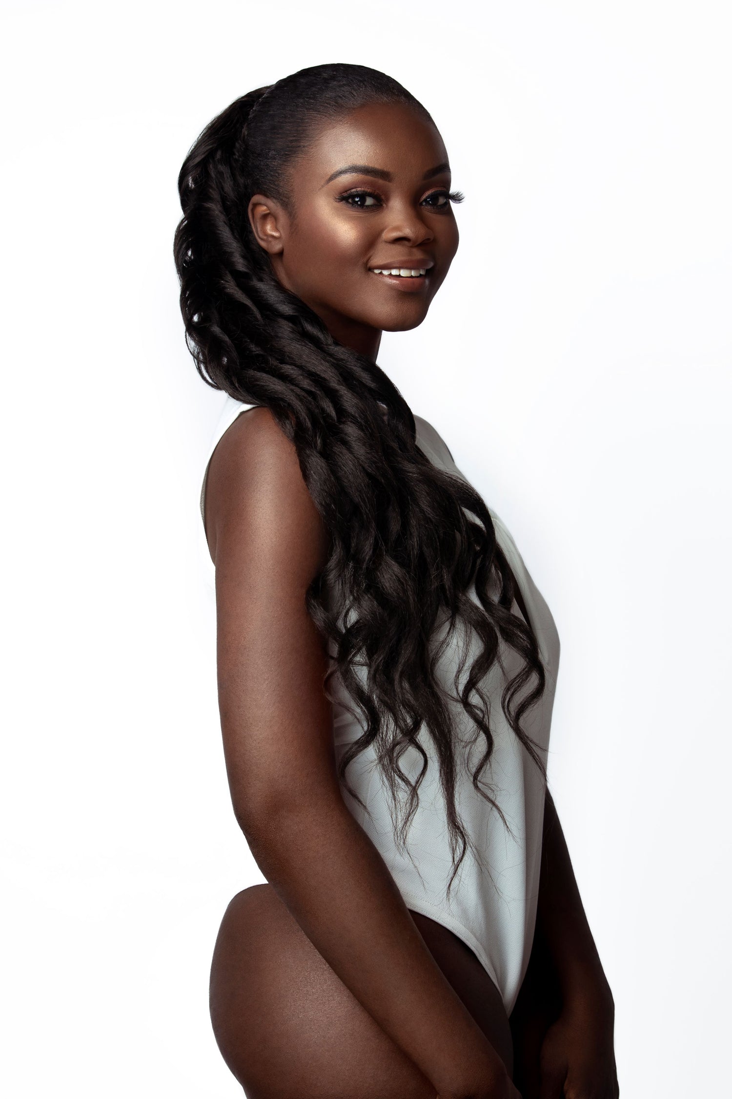 18 inch Brazilian curly drawstring ponytail extensions on a woman