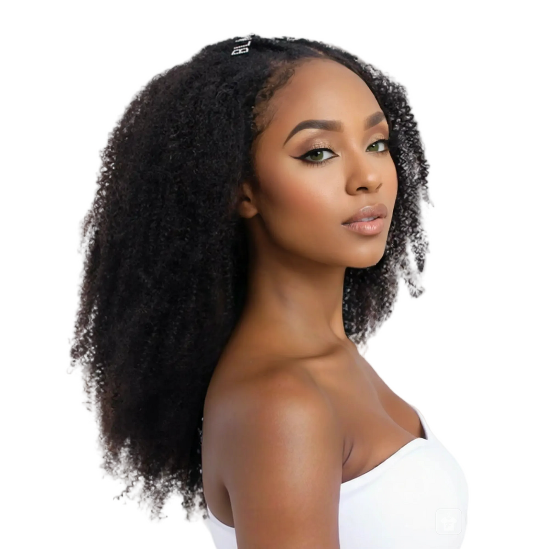 Woman with curly afro styled hair wearing a white top on a white background