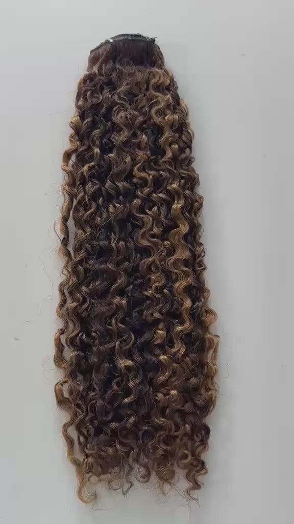 A brown curly hair bundle with blonde highlights