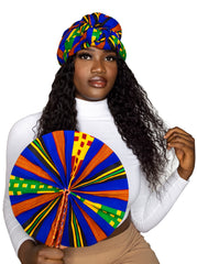 A woman with kente ankara headwrap and hand fan