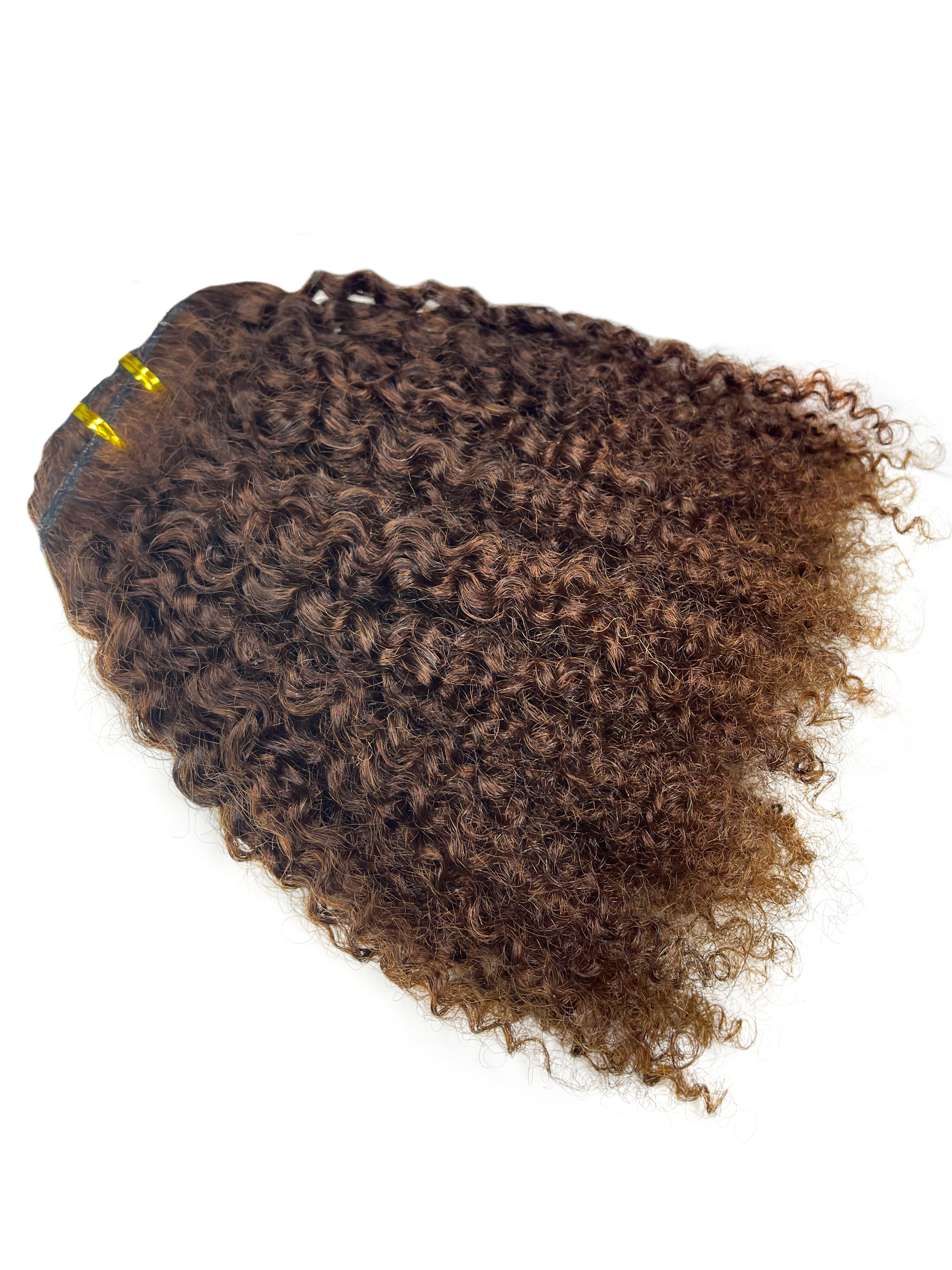 Brown curly weft that has been colored by a professional 