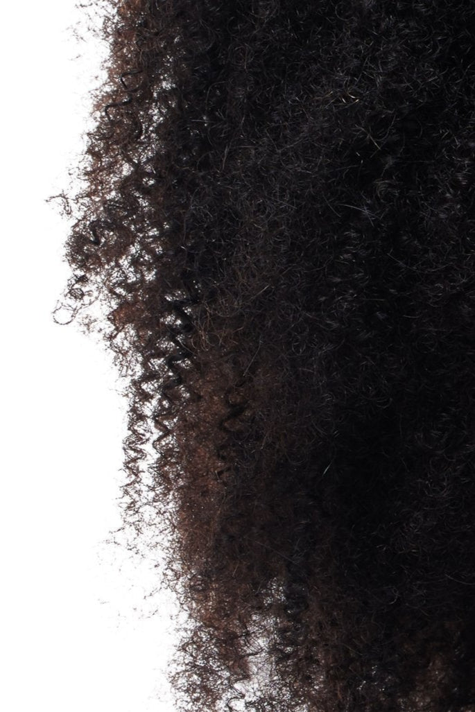 Kinky coarse 4c human hair clip-ins on a black woman